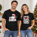 I'm Santa Christmas graphic tees in black, front view on a couple wearing the men's and women's designs