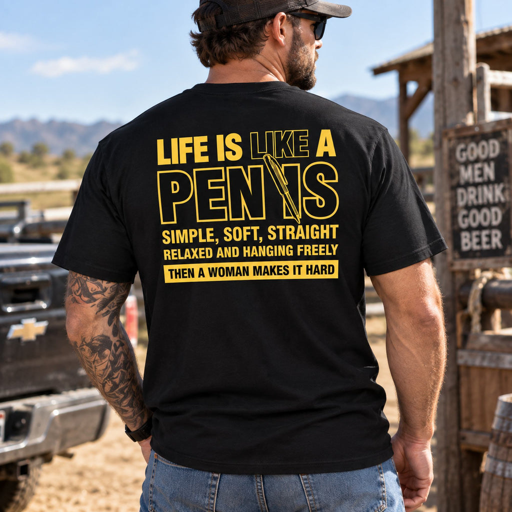 Life Is Like A Pen adult humor graphic tee in black, male model showing yellow back print outdoors