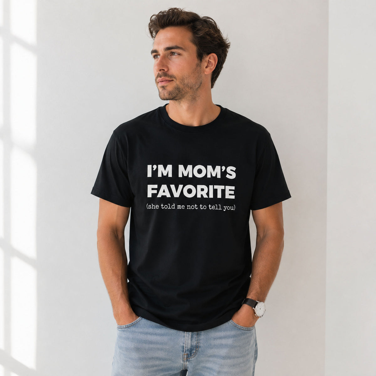 I'm Mom's Favorite funny graphic tee black front male model