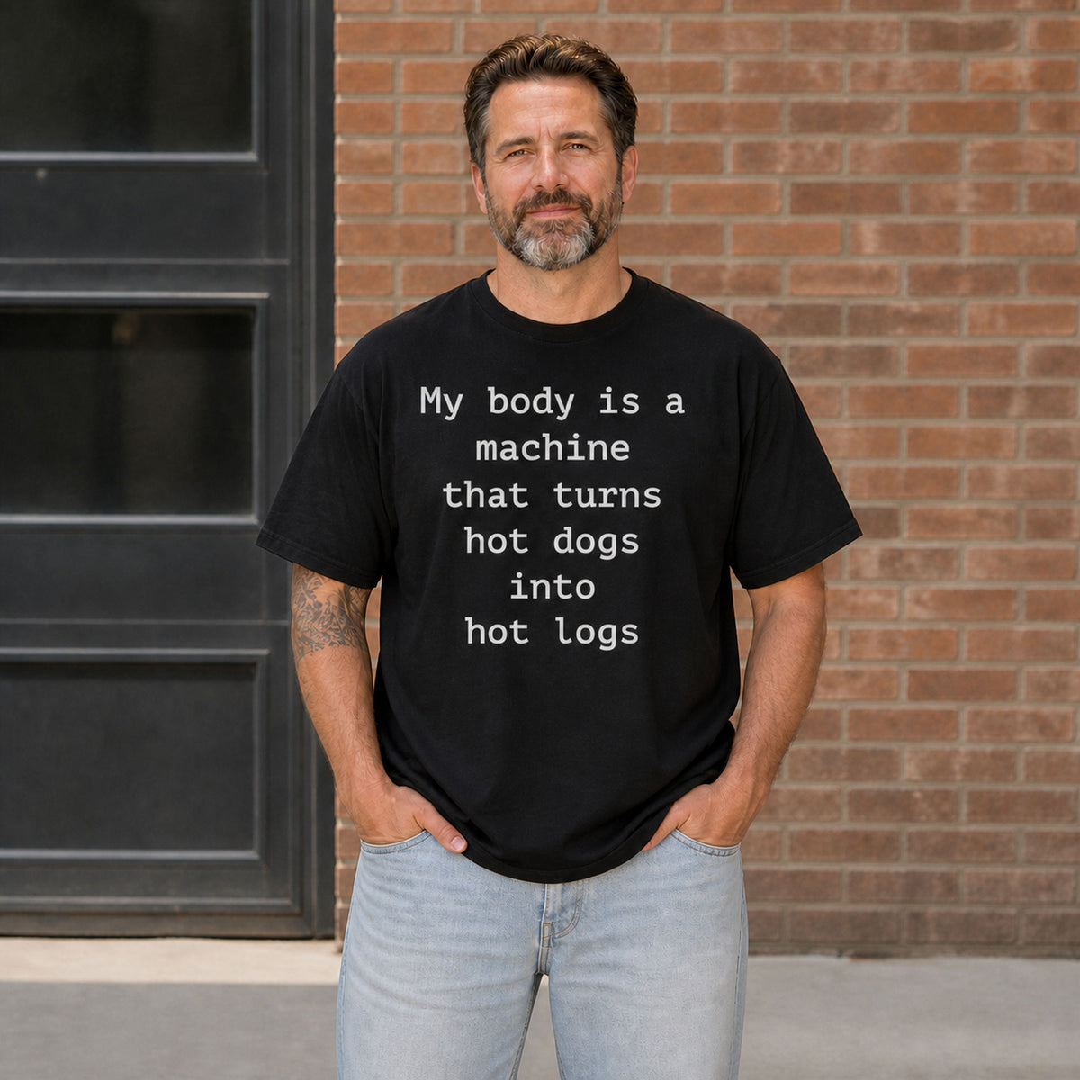 My body is a machine that turns hot dogs into hot logs black funny graphic tee on male model, front view
