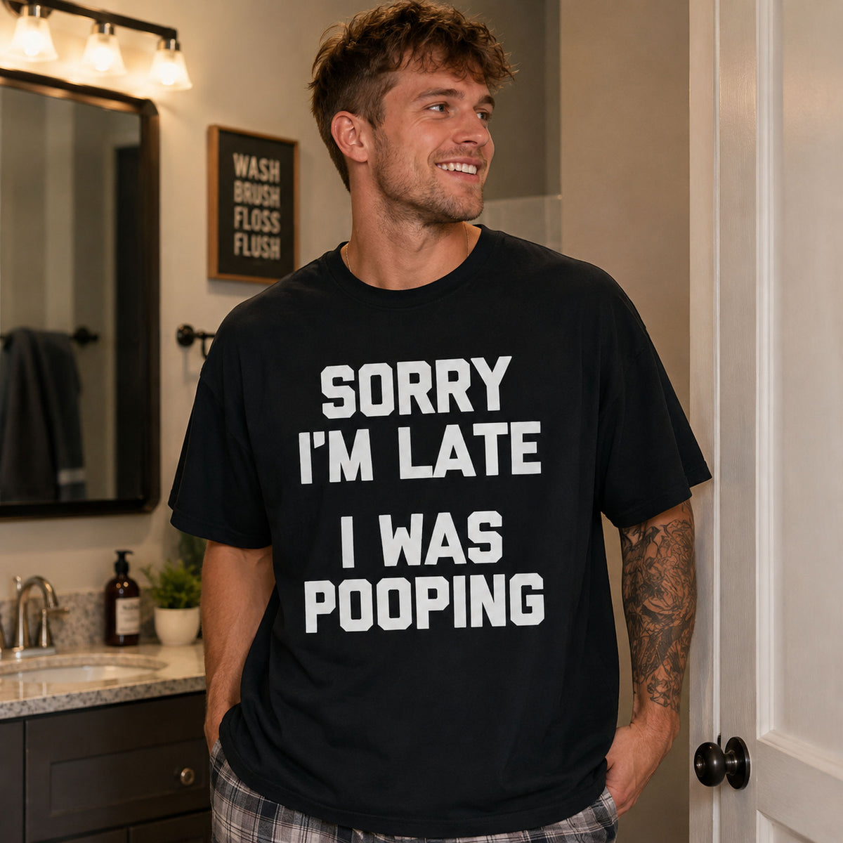 Sorry I'm Late I Was Pooping funny graphic tee black front bathroom lifestyle male model