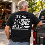 It's Not Easy Being My Wife's Arm Candy black graphic tee oversized back print garage model
