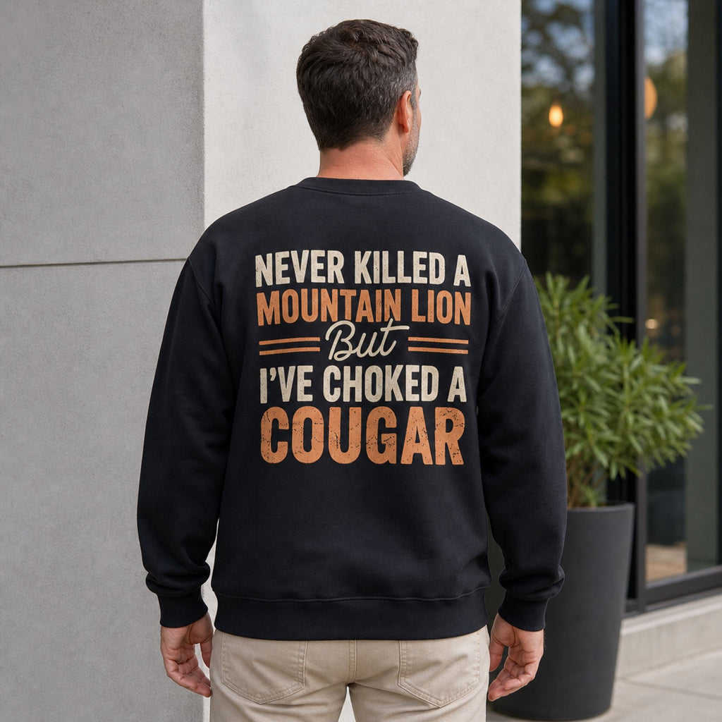 Never Killed a Mountain Lion cougar joke black crewneck sweatshirt back print on middle-aged male model