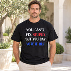 You Cant Fix Stupid But You Can Vote It Out red white blue slogan graphic on black T-shirt front, adult model photo