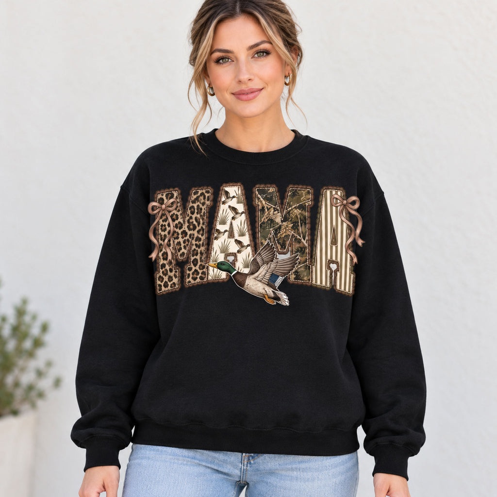 MAMA patchwork-style lettering, bows and flying mallard on black sweatshirt front, adult woman model photo