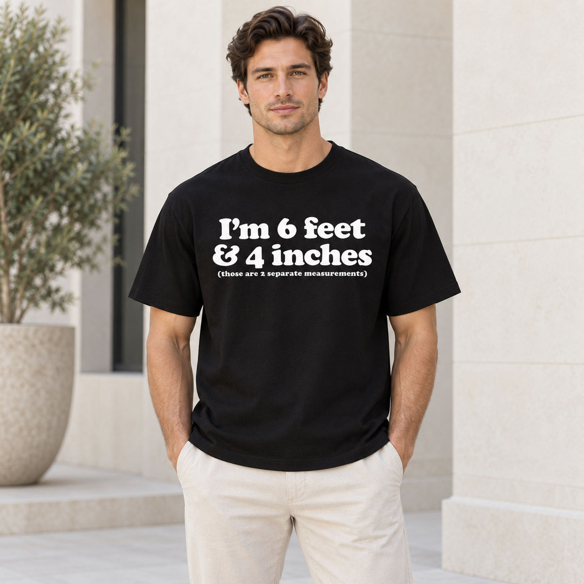 Black graphic tee front adult model with I'm 6 Feet And 4 Inches design