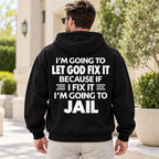 Let God Fix It because if I fix it I am going to jail slogan on black hoodie back, adult model photo