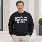 Sorry I’m Late sarcastic front print on a black sweatshirt, male model standing outdoors