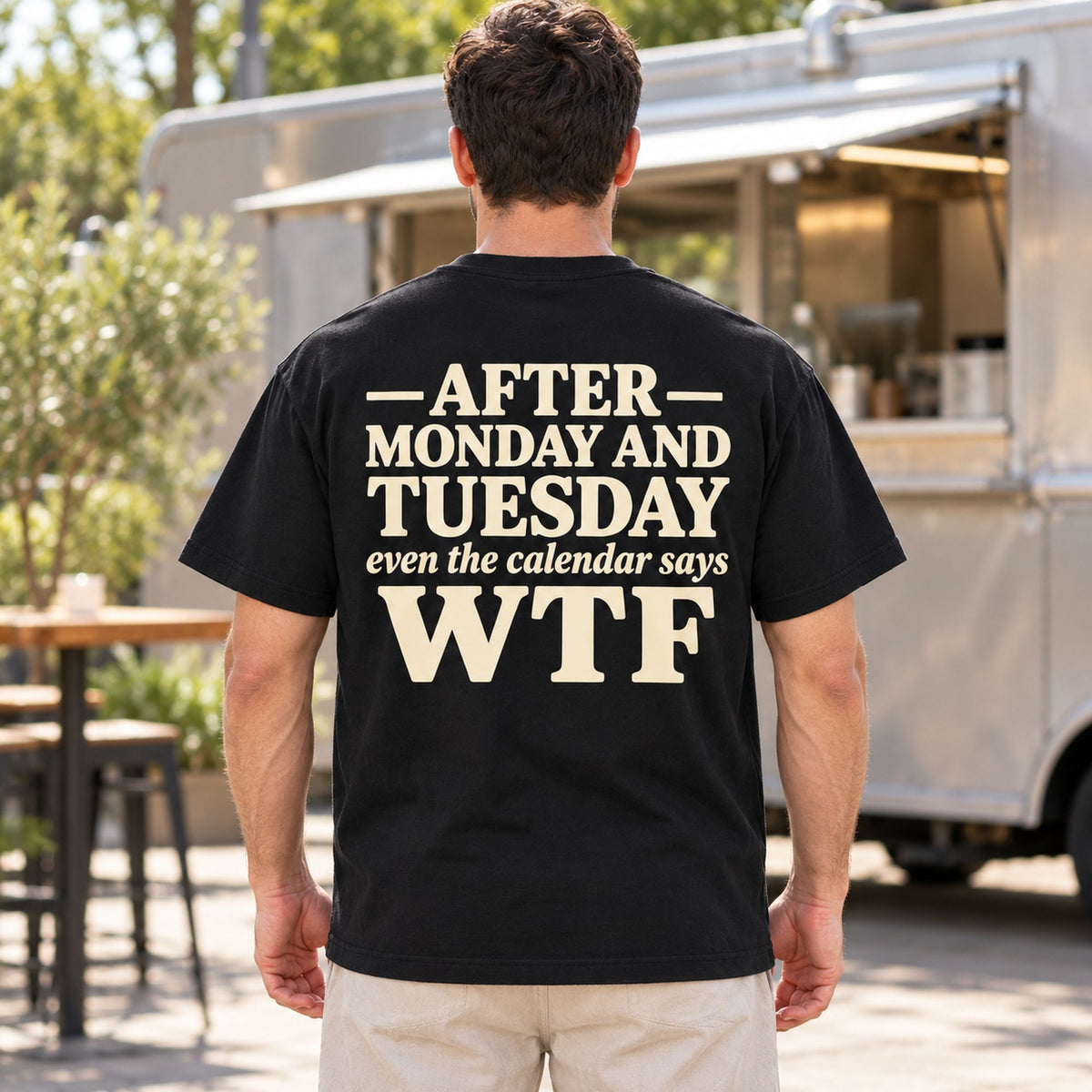 After Monday and Tuesday calendar WTF black back-print tee on outdoor model