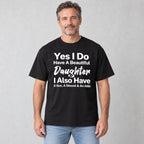 Beautiful Daughter funny dad front print on a black T-shirt, male model in a bright room