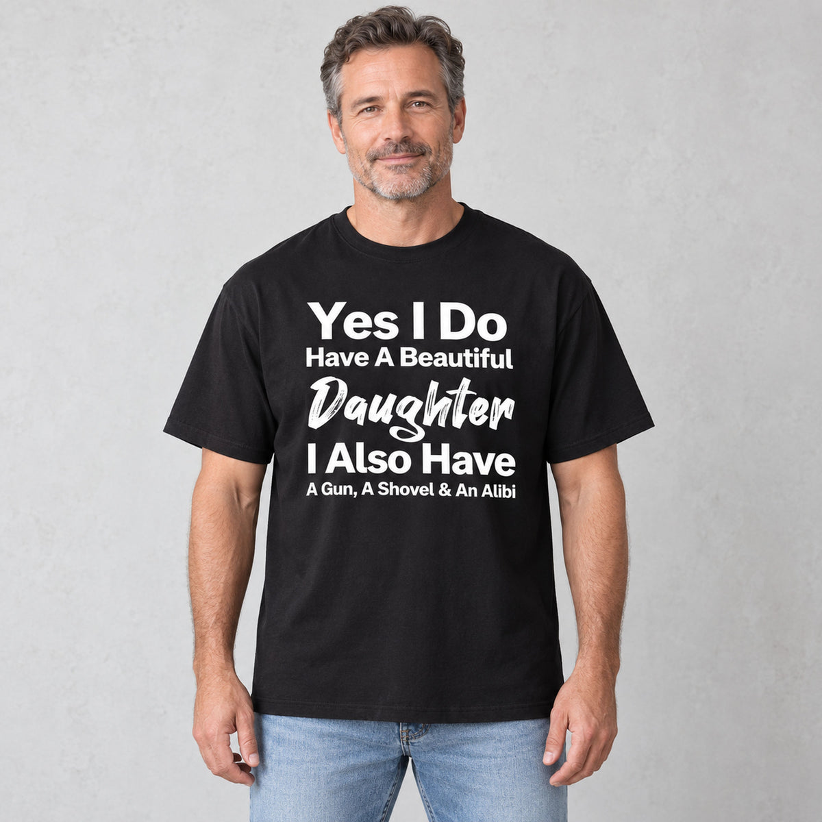 Beautiful Daughter funny dad front print on a black T-shirt, male model in a bright room
