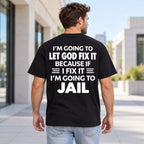 Let God Fix It Going to Jail joke lettering on black T-shirt back, adult male model outdoors