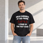 Hello Darkness My Old Friend black graphic tee, front-facing model with distressed white slogan and red heartbeat design