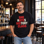 She Hates History Class black T-shirt on a model, front print with red and white wordplay letters