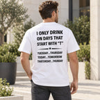 I Only Drink on Days That Start With T white graphic tee with black back print on a male model in a courtyard