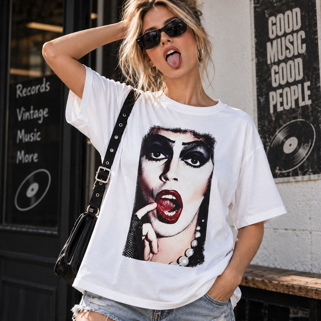 Cult glam horror portrait white graphic tee front view on a female model in a music store setting