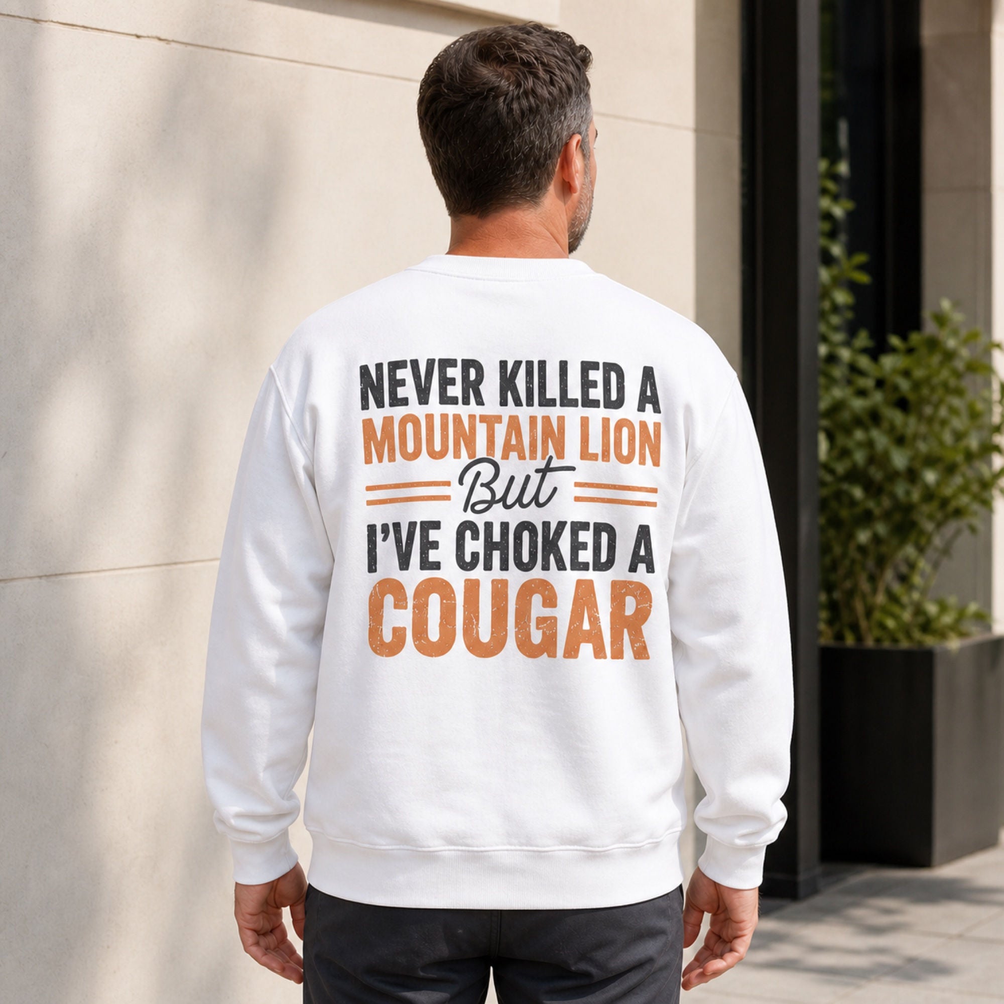 Never Killed a Mountain Lion adult humor white crewneck sweatshirt back print on middle-aged male model