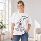 Boop ghost dog Halloween graphic tee in white, front print on a female model beside a window