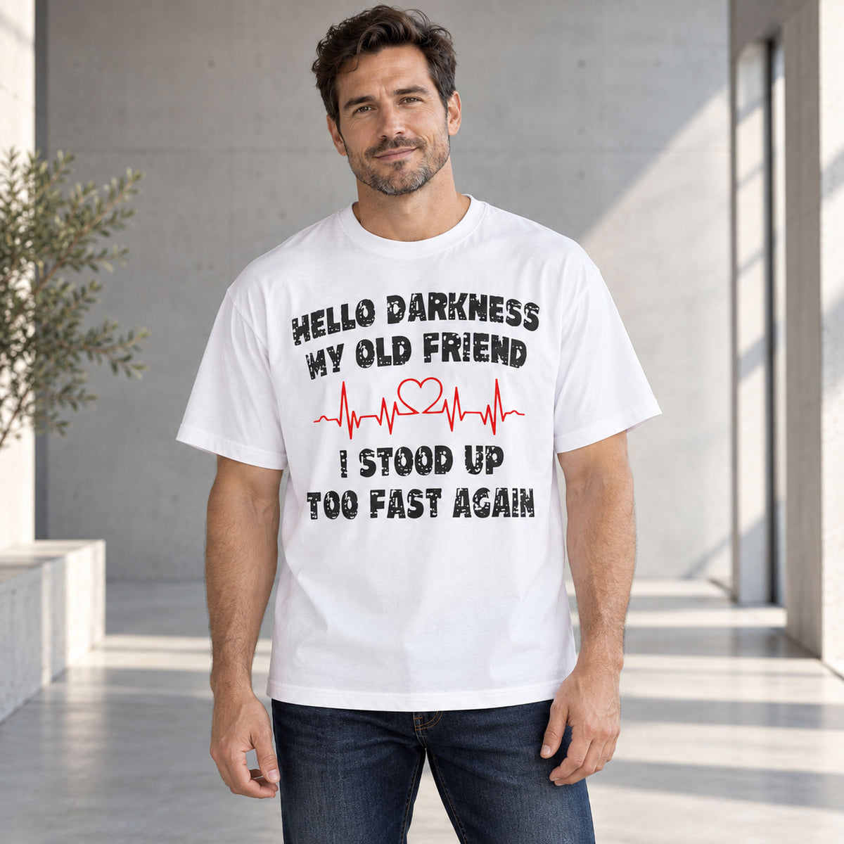 Hello Darkness My Old Friend white graphic tee, front model showing black lettering and a red heart in the heartbeat line