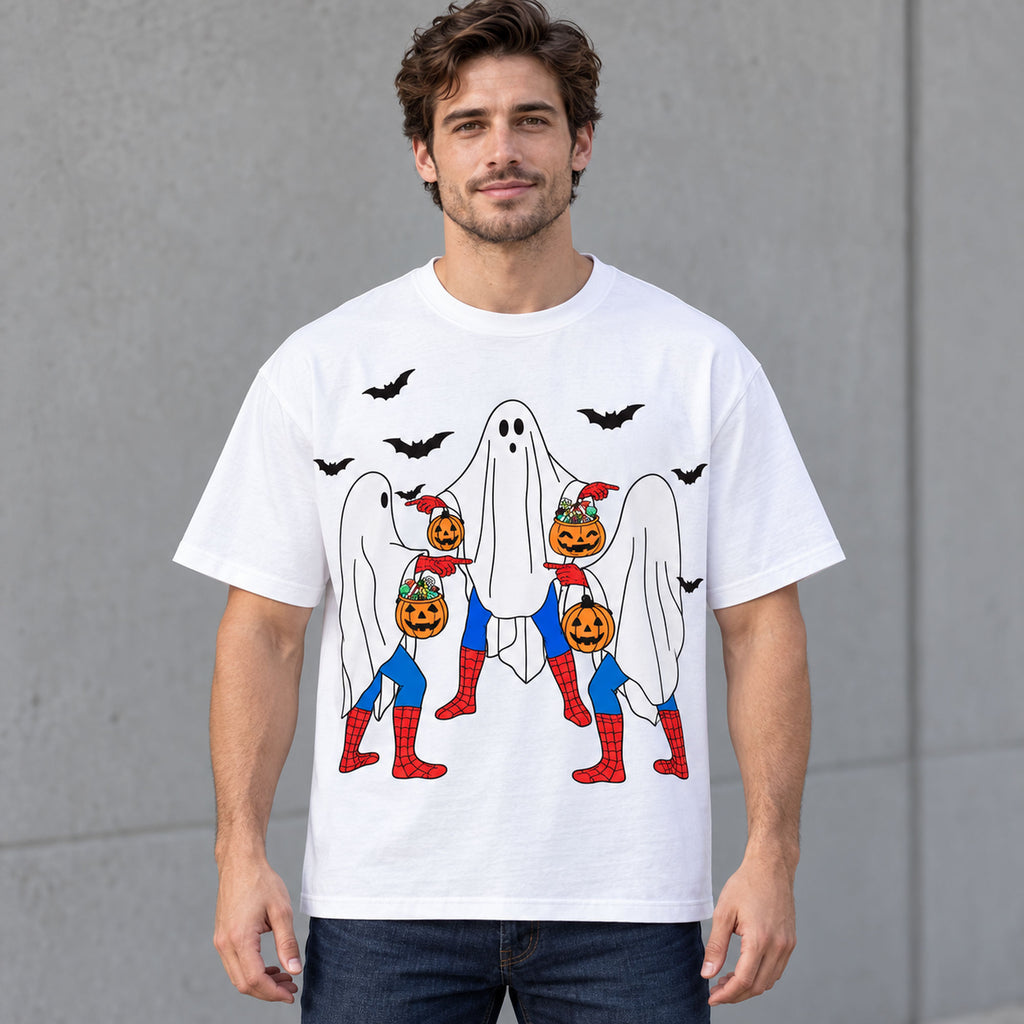 Halloween ghost trio and pumpkins front print on a white T-shirt worn by a male model