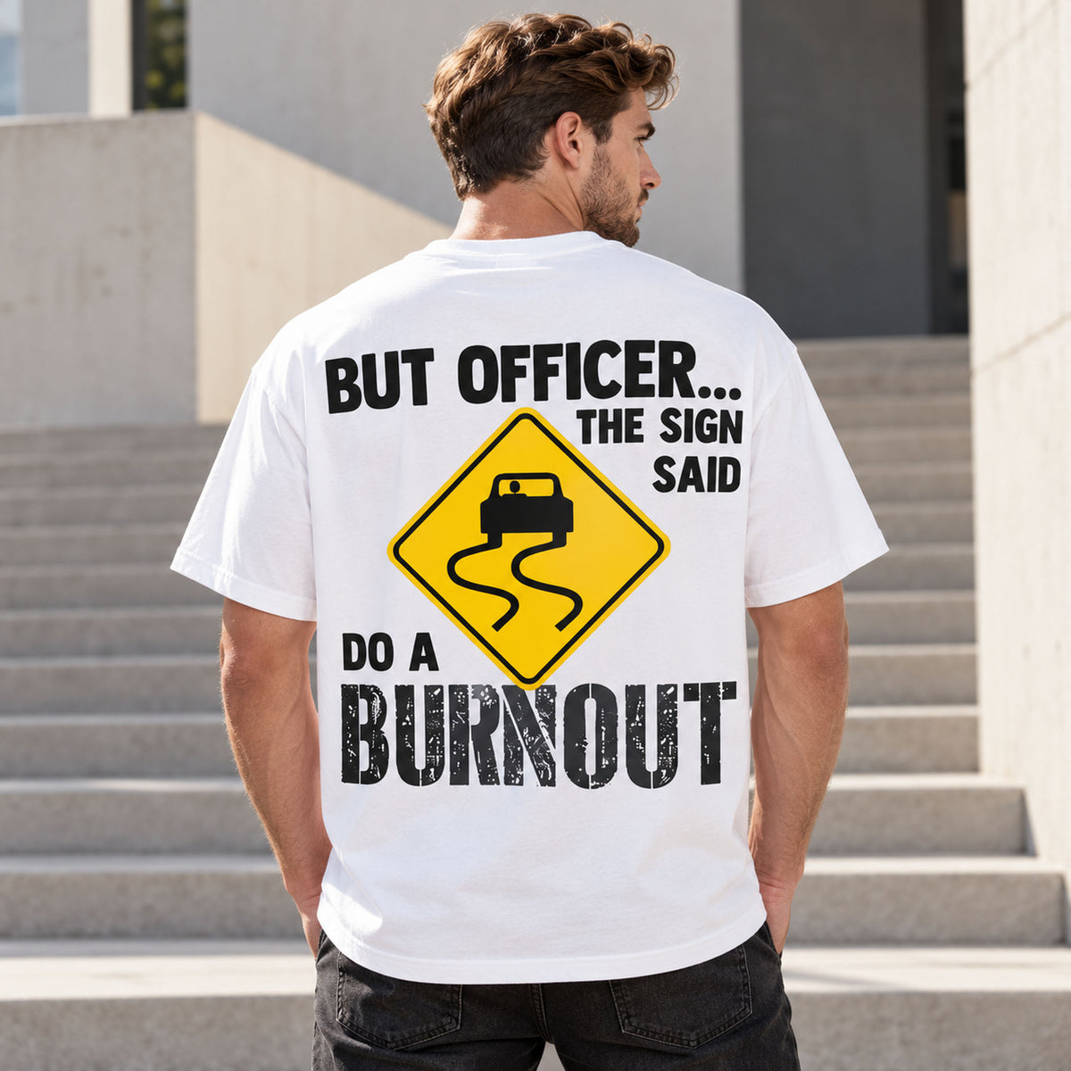 But Officer The Sign Said Do a Burnout yellow skidding-car sign graphic on white T-shirt back, adult model photo
