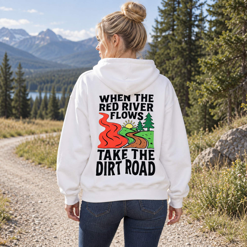 When The Red River Flows Take The Dirt Road white hoodie back print woman by mountain scenery