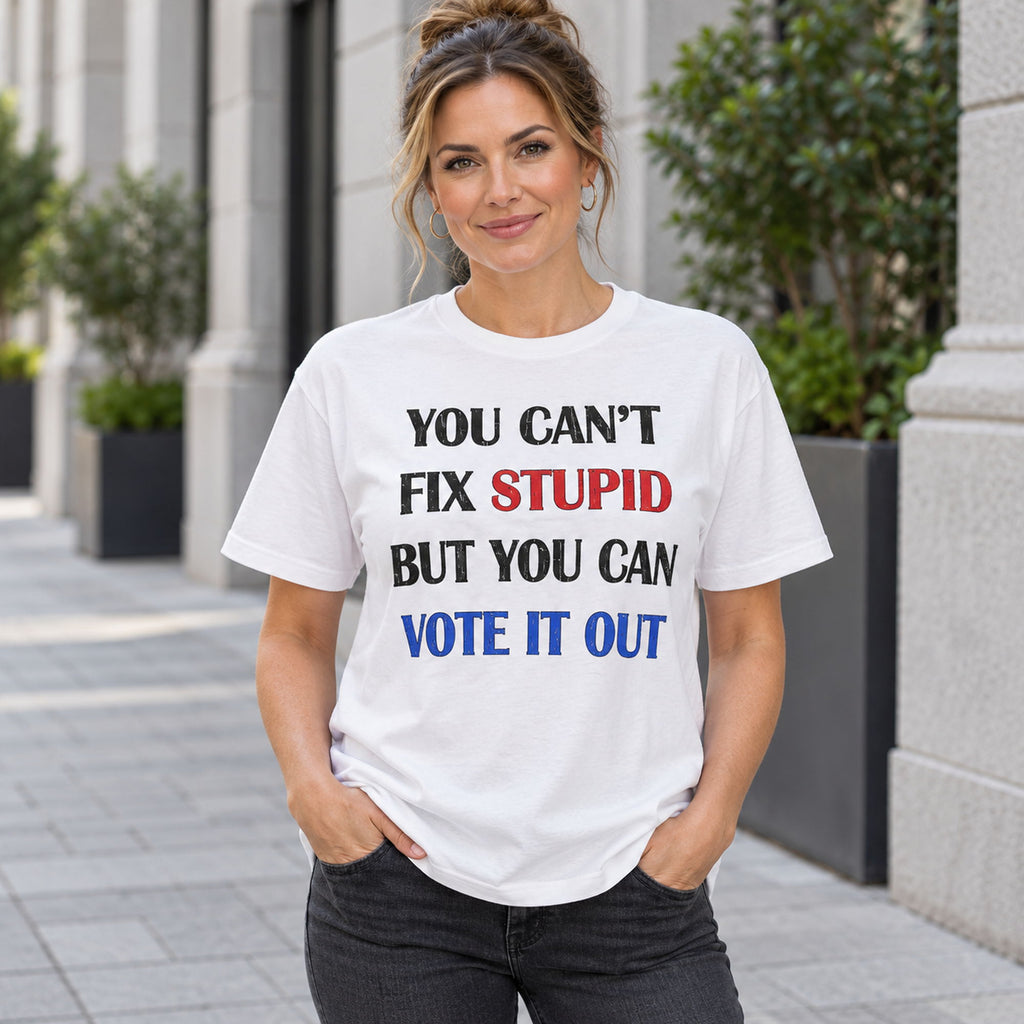 You Cant Fix Stupid But You Can Vote It Out red white blue slogan graphic on white T-shirt front, adult model photo