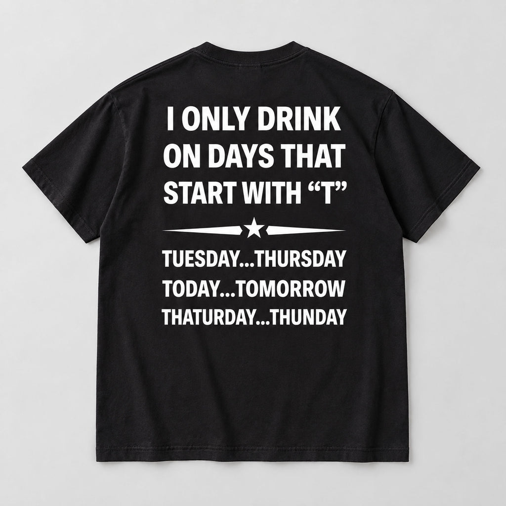 I Only Drink on Days That Start With T black graphic tee back flat lay with white lettering and star divider