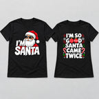 Black Christmas couple graphic tees laid flat, men's I'm Santa design left and women's design right