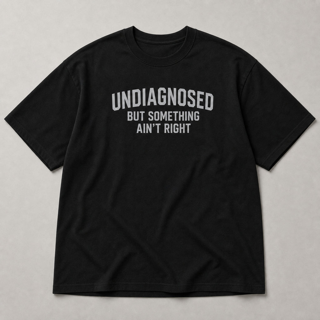 Undiagnosed But Something Ain't Right funny graphic tee black front flat lay