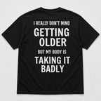Getting Older Taking It Badly funny graphic tee black back print flat lay