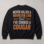 Never Killed a Mountain Lion cougar joke black crewneck sweatshirt back-side flat lay