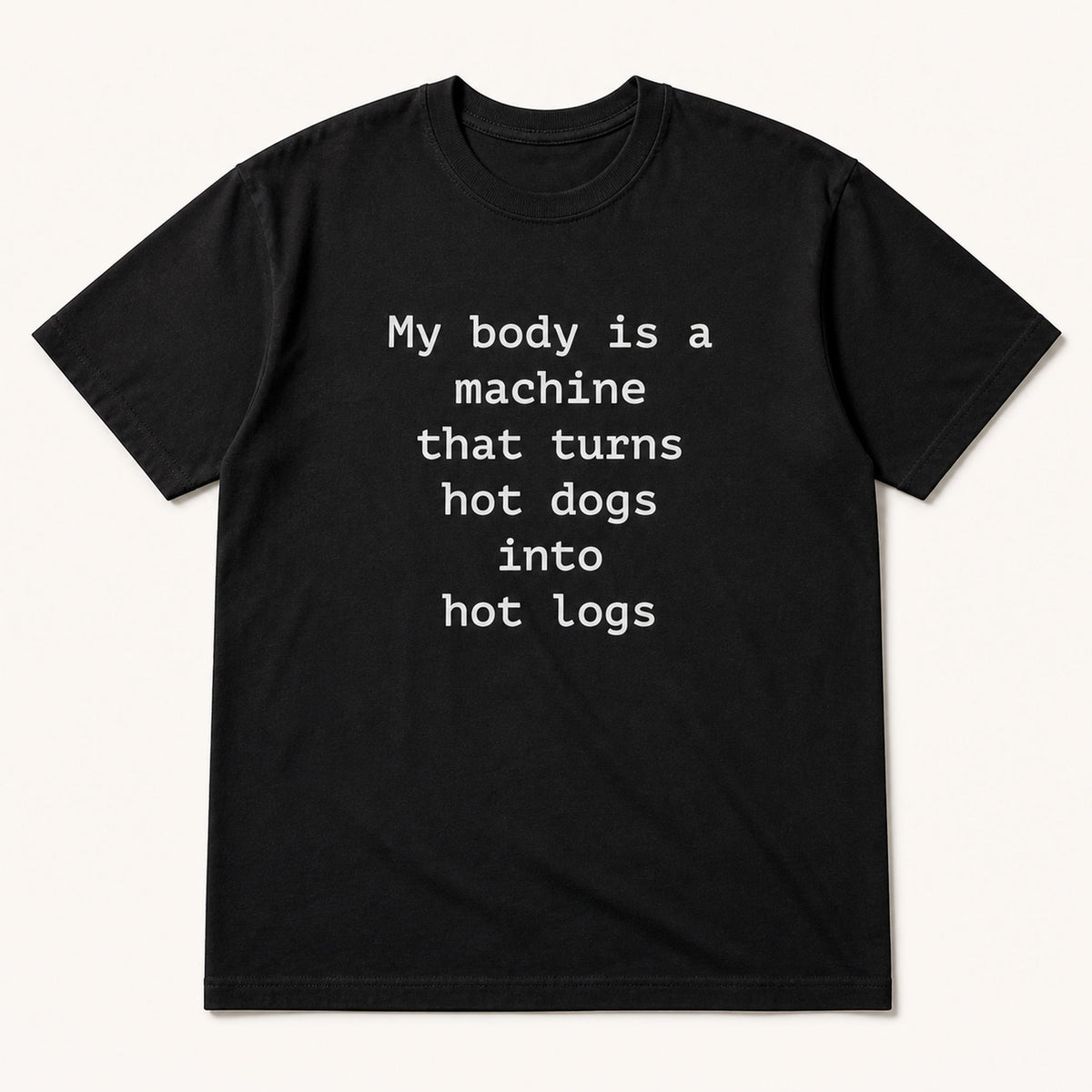 My body is a machine that turns hot dogs into hot logs black funny graphic tee, front flat-lay view