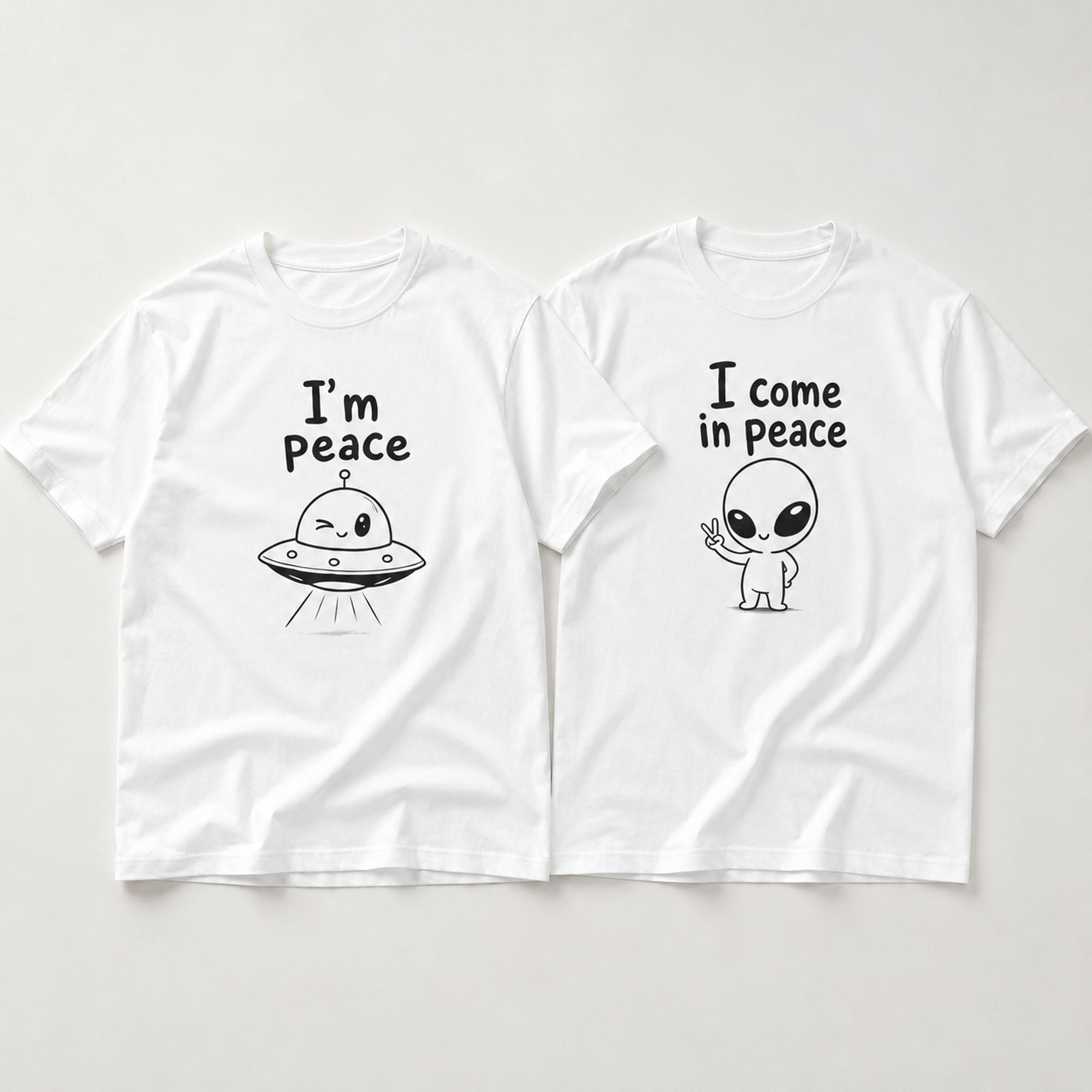 I Come In Peace matching couple alien graphic tee white front flat lay