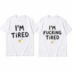 I'm Tired and I'm Fucking Tired matching couple white graphic tees front flat lay