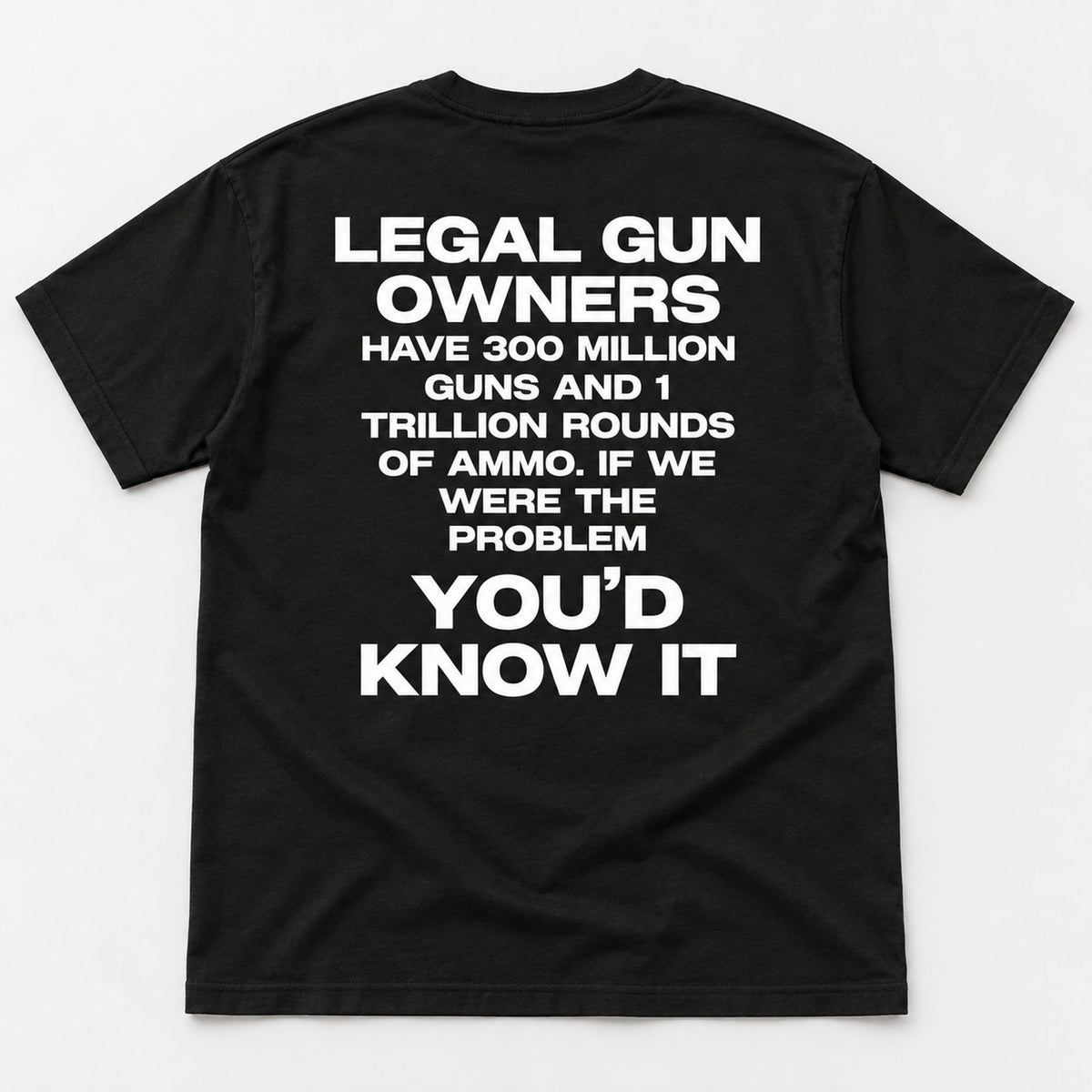 Legal Gun Owners statement back print on a black T-shirt, flat lay showing the complete lettering