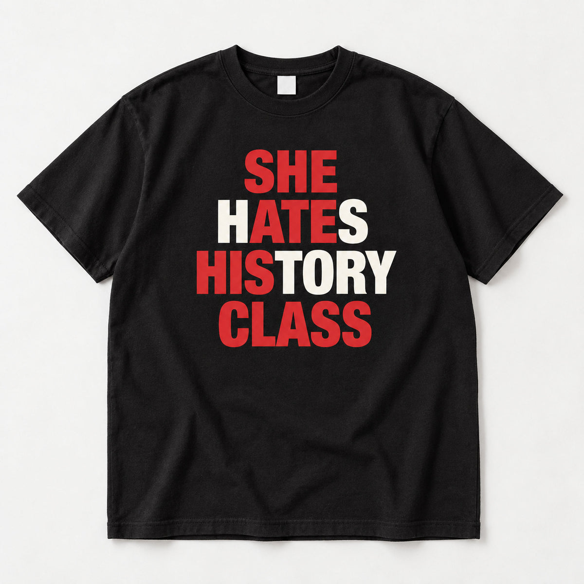 She Hates History Class black graphic T-shirt flat lay with red letter accents across four lines