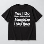 Beautiful Daughter funny dad front print on a black T-shirt, flat lay showing the complete lettering