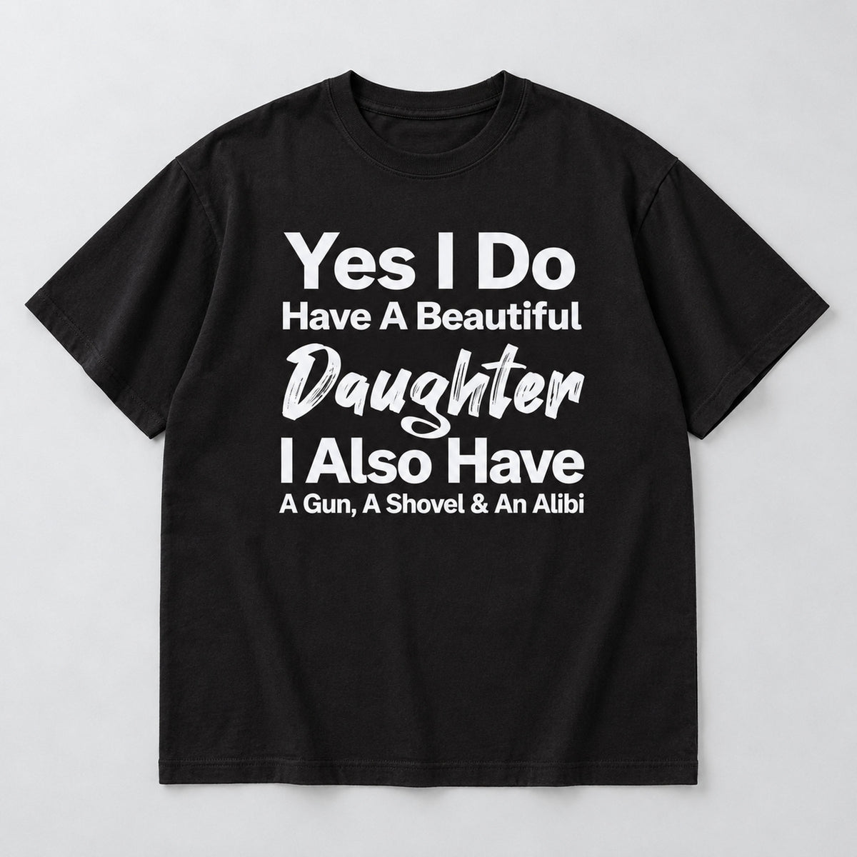 Beautiful Daughter funny dad front print on a black T-shirt, flat lay showing the complete lettering