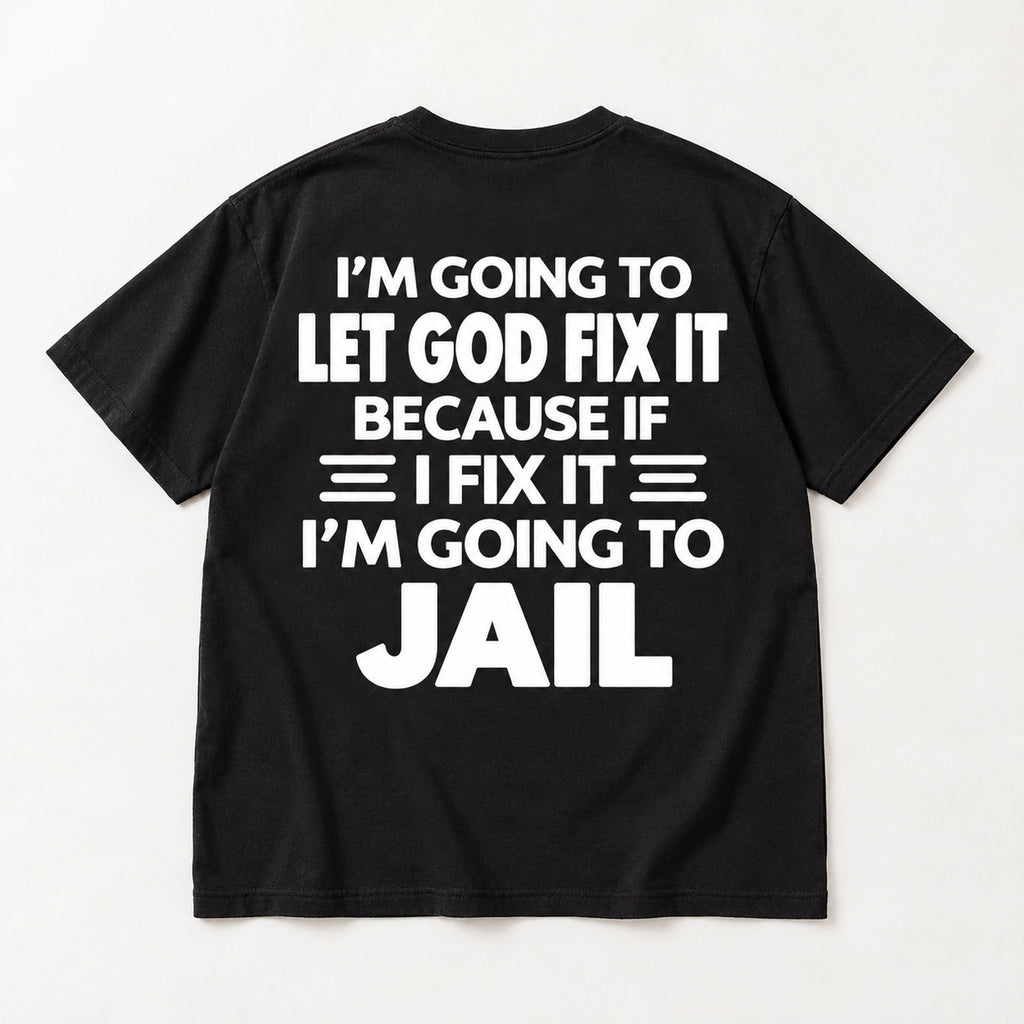 Let God Fix It Going to Jail large white lettering on black T-shirt back flat lay