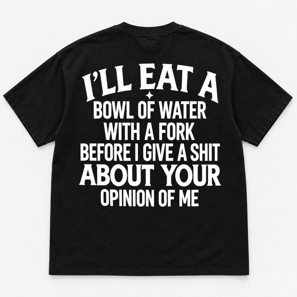 Bowl of Water With a Fork uncensored opinion-of-me slogan on black T-shirt back, flat lay showing complete print