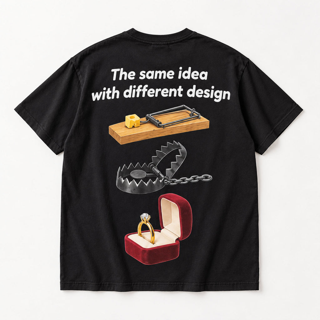 The same idea with different design mousetrap steel trap and ring box graphic on black T-shirt back, flat lay showing complete print