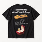 The same idea with different design mousetrap steel trap and ring box graphic on black T-shirt back, flat lay showing complete print