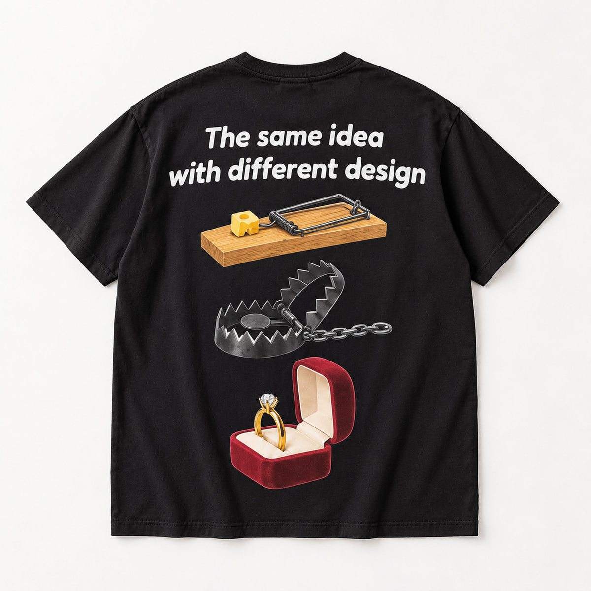 The same idea with different design mousetrap steel trap and ring box graphic on black T-shirt back, flat lay showing complete print