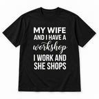 Black graphic tee front flat lay with My Wife And I Have A Workshop design