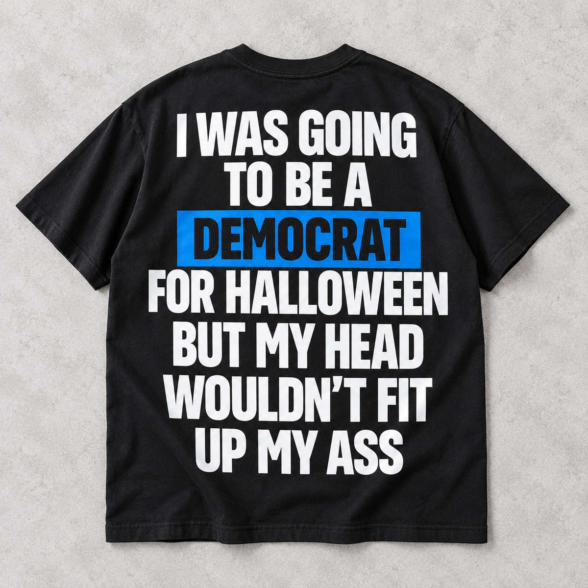Democrat for Halloween original political-satire slogan with blue word highlight on black T-shirt back, flat lay showing complete print