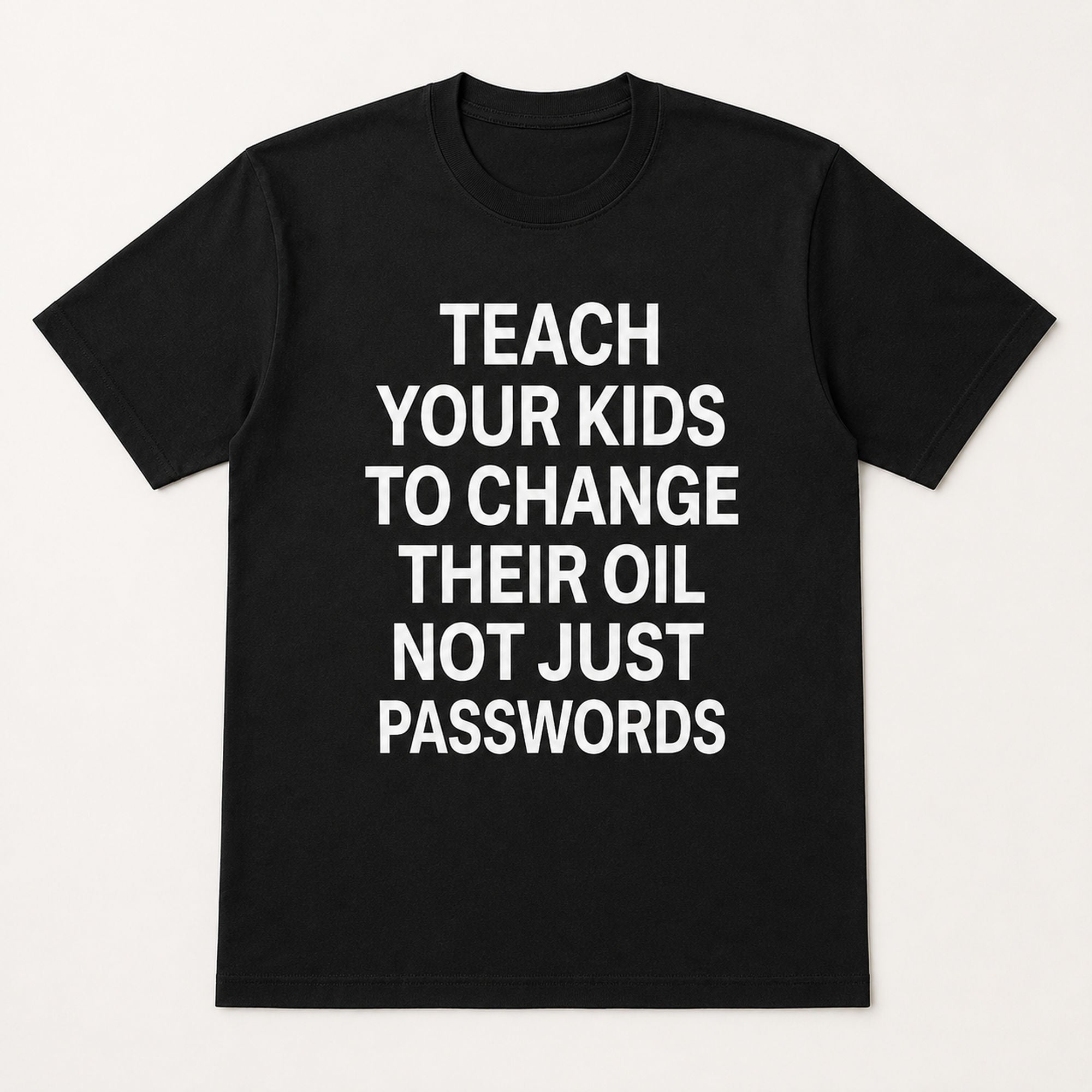 Teach Your Kids To Change Their Oil mechanic humor graphic tee black front print flat lay
