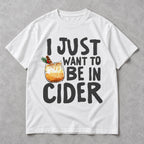 I Just Want to Be in Cider Christmas drink graphic on white T-shirt front, flat lay