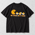 You Know Why Im Here deviled eggs and yellow chomping character graphic on black T-shirt front, flat lay showing complete print