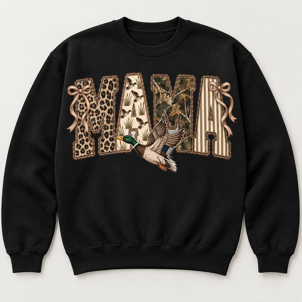 MAMA patchwork-style lettering, bows and flying mallard on black sweatshirt front, flat lay showing complete print
